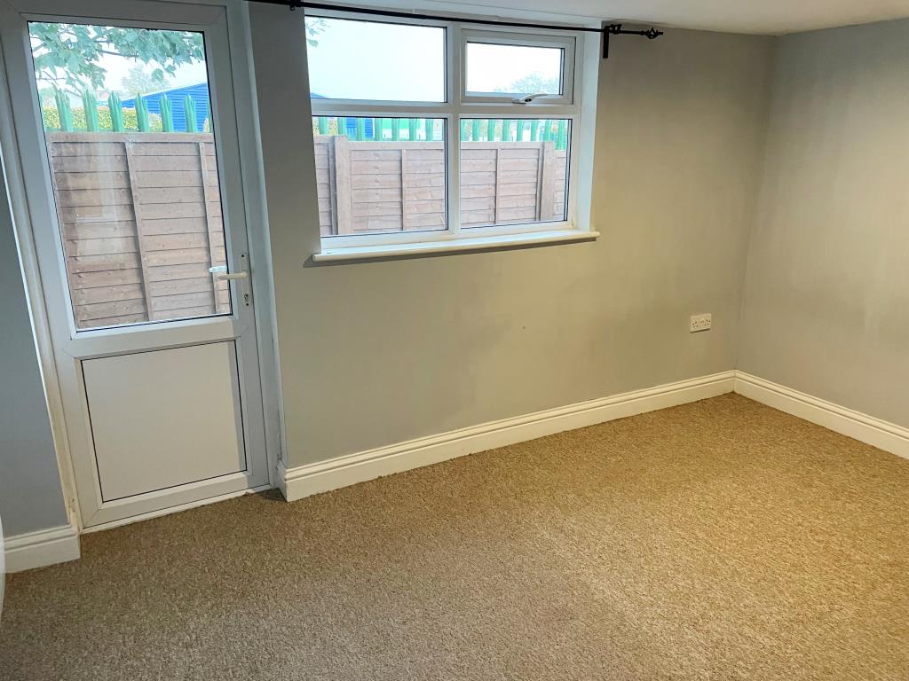 Lot: 145 - DETACHED BUNGALOW IN TOWN CENTRE - View of main bedroom with door to garden